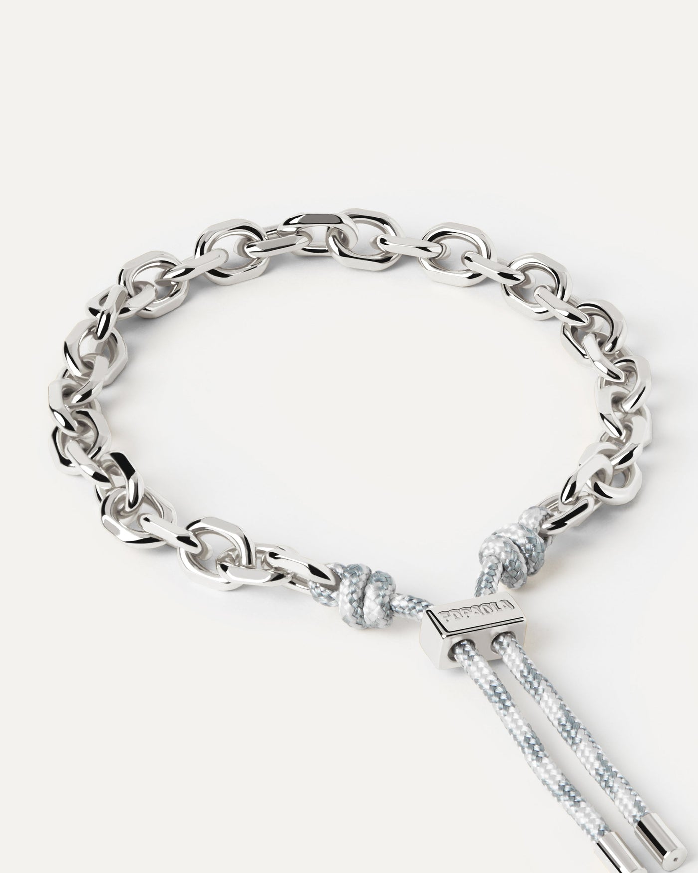 Silver tone chain bracelet with a blue and white rope adjustable sliding clasp