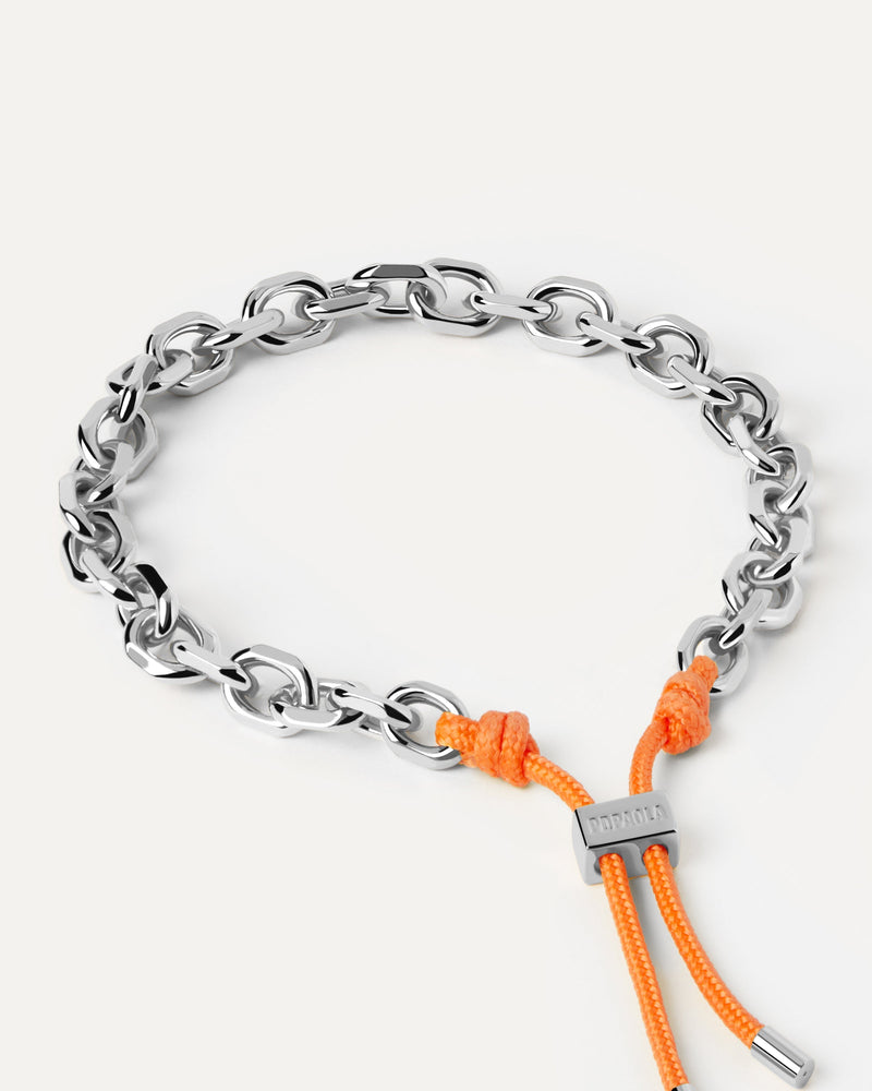 Silver tone chain bracelet with an orange rope adjustable sliding clasp