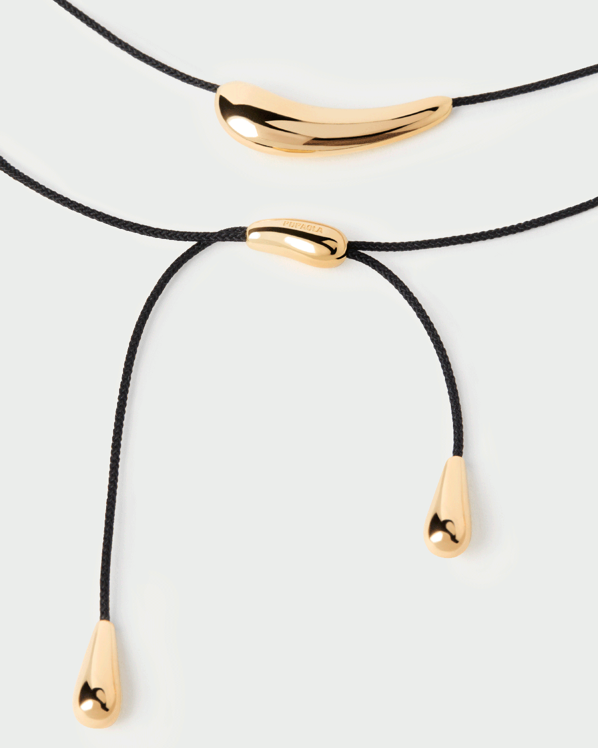 Adjustable black cord choker necklace with a drop design | Orbit cord ...