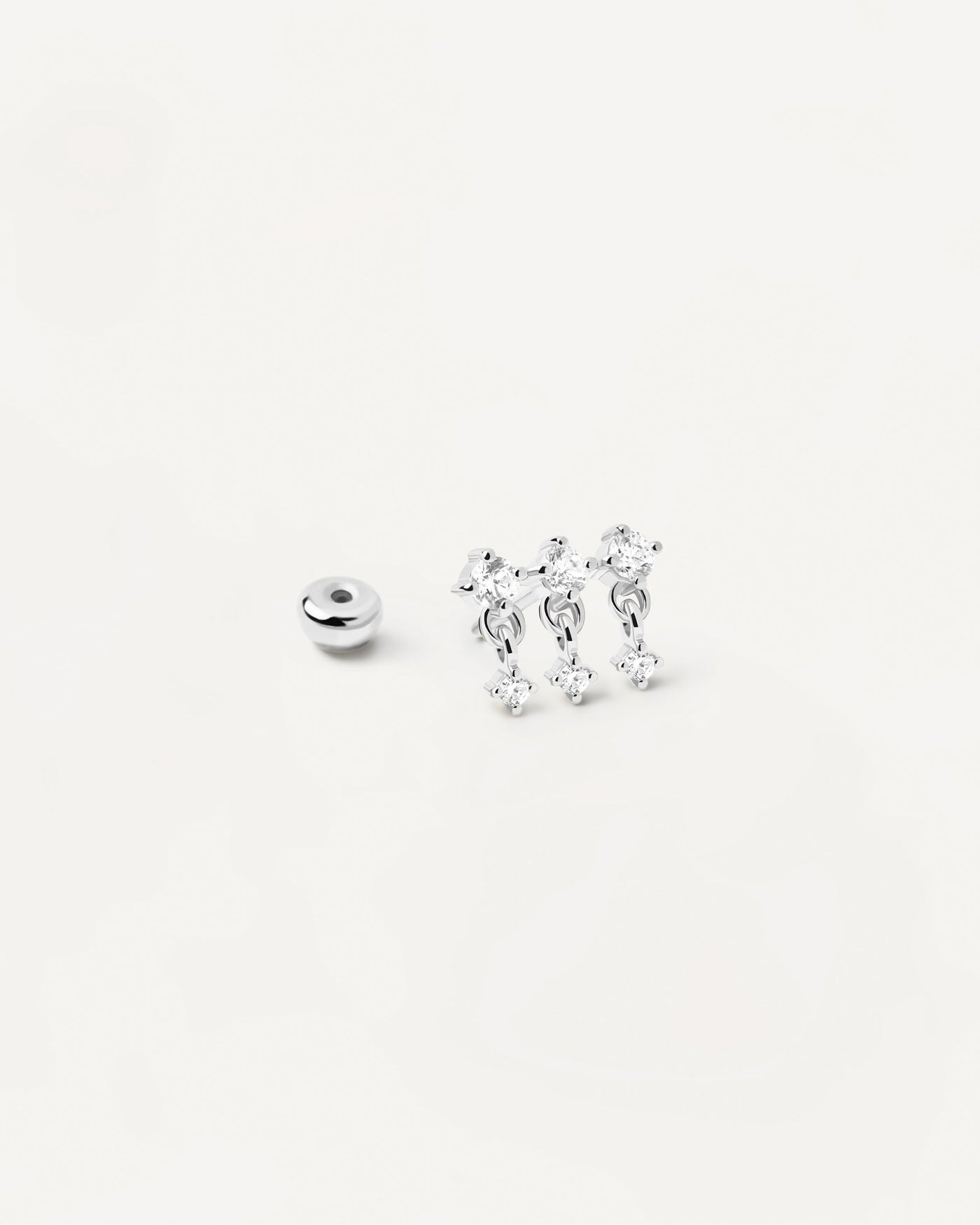 Sterling silver ear piercing with trinity of white zirconia