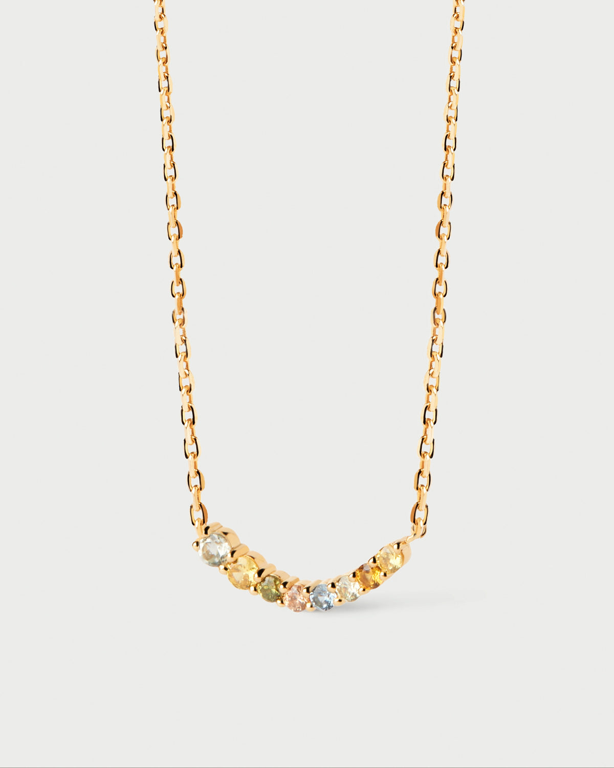 Collana sottile placcata oro con una serie ondulata di zirconi multicolore