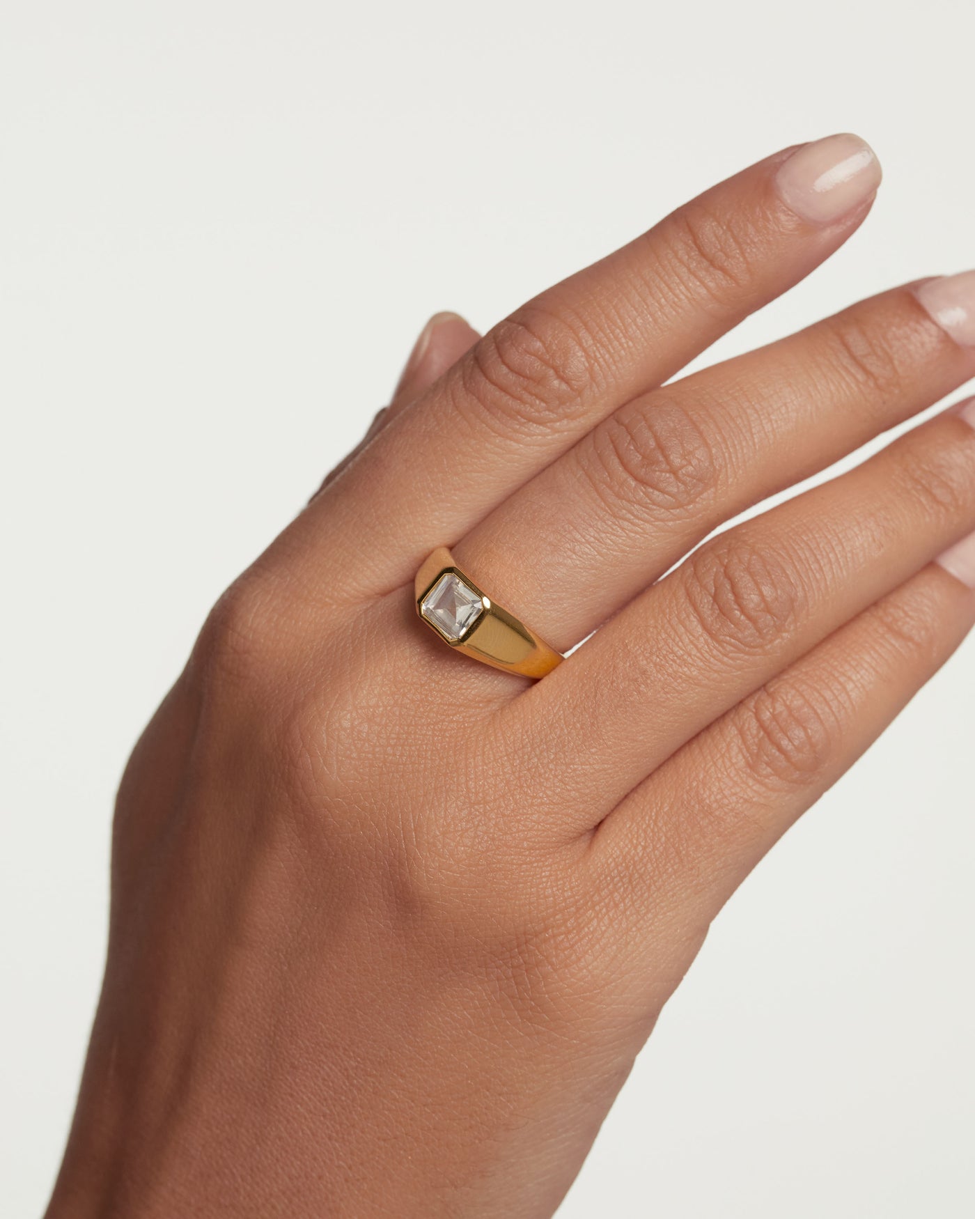 Gold-plated silver statement ring with square white zirconia