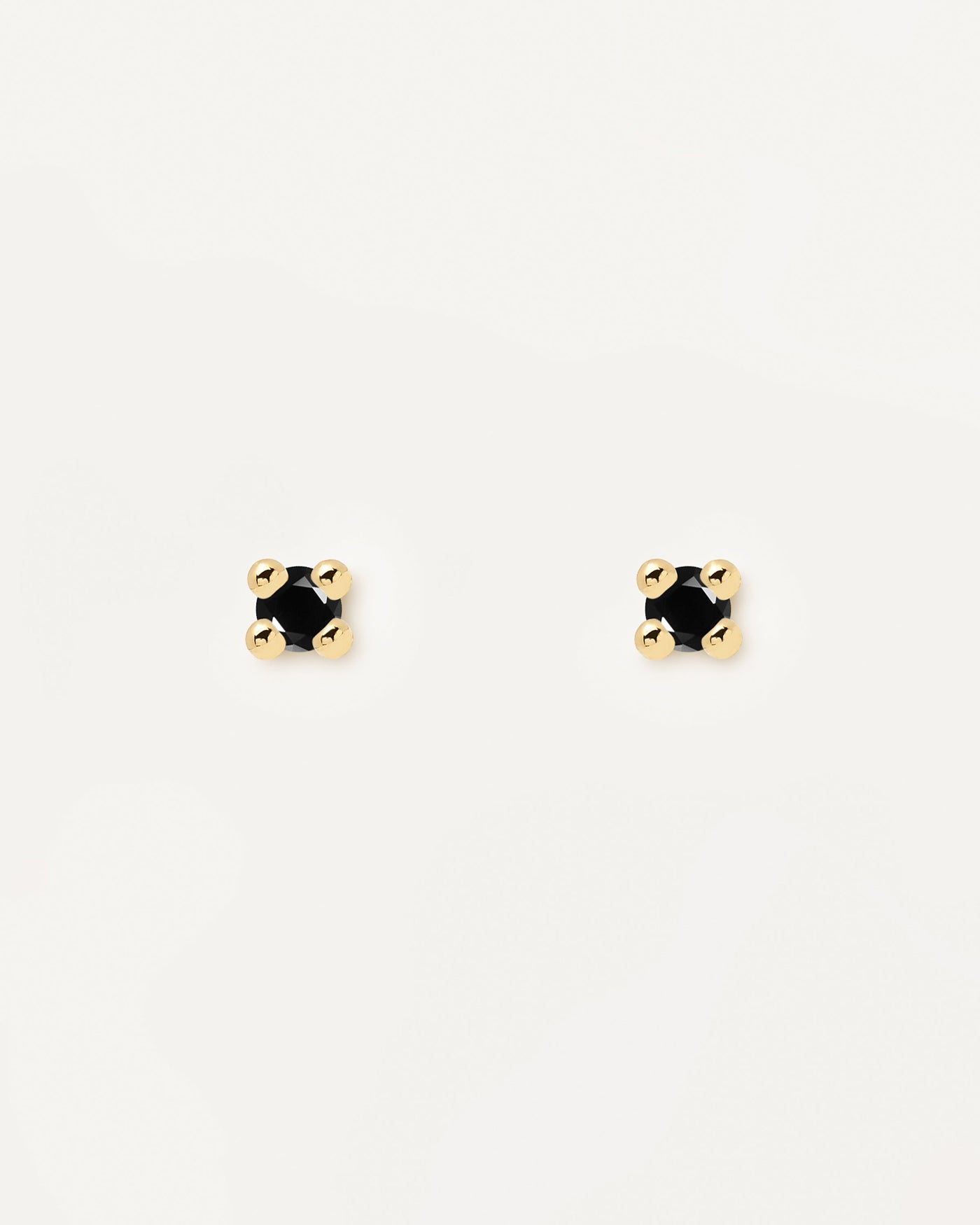 18k gold plated silver stud earrings with a cut black zirconia