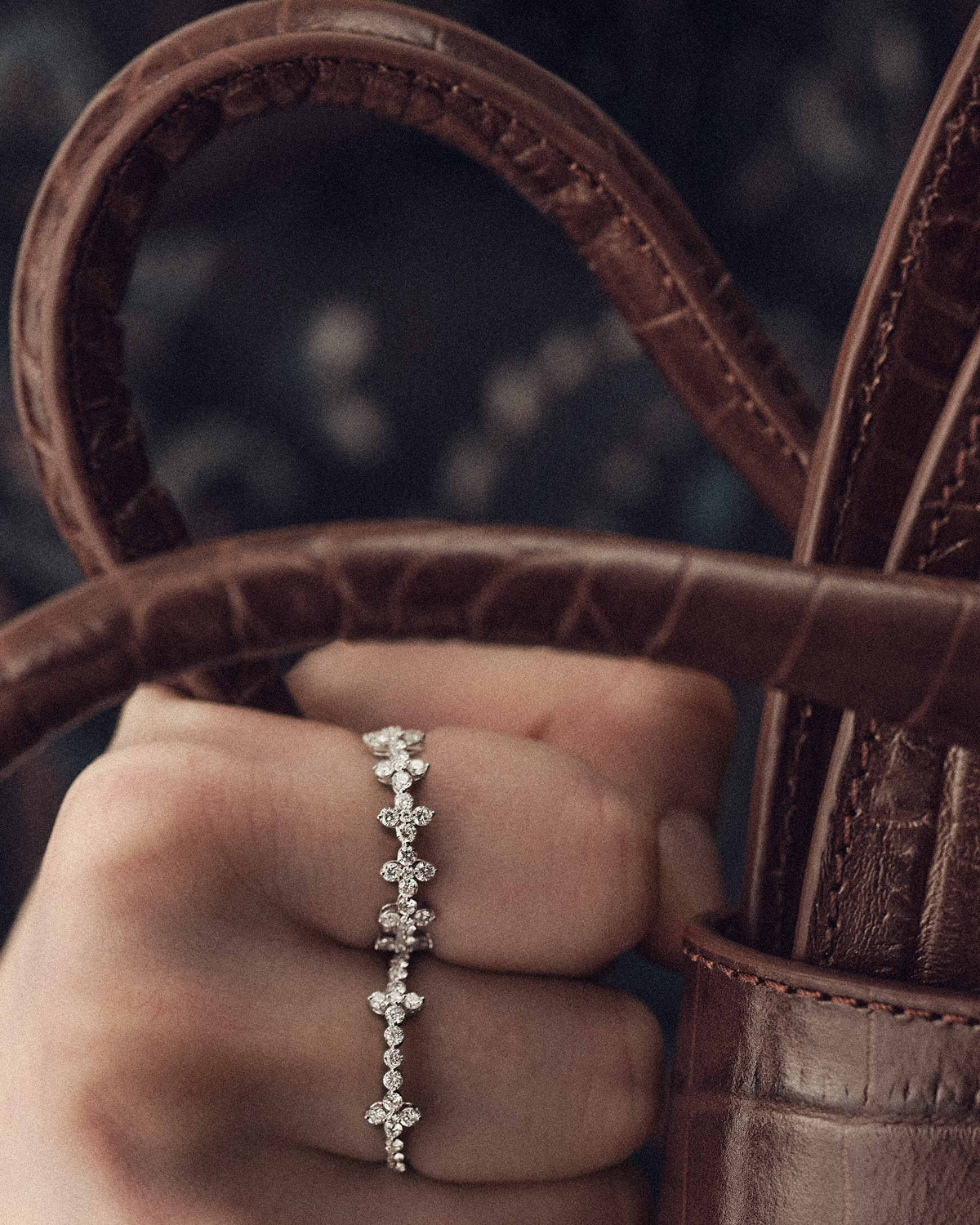 White gold necklace with lab-grown diamonds and floral accents.