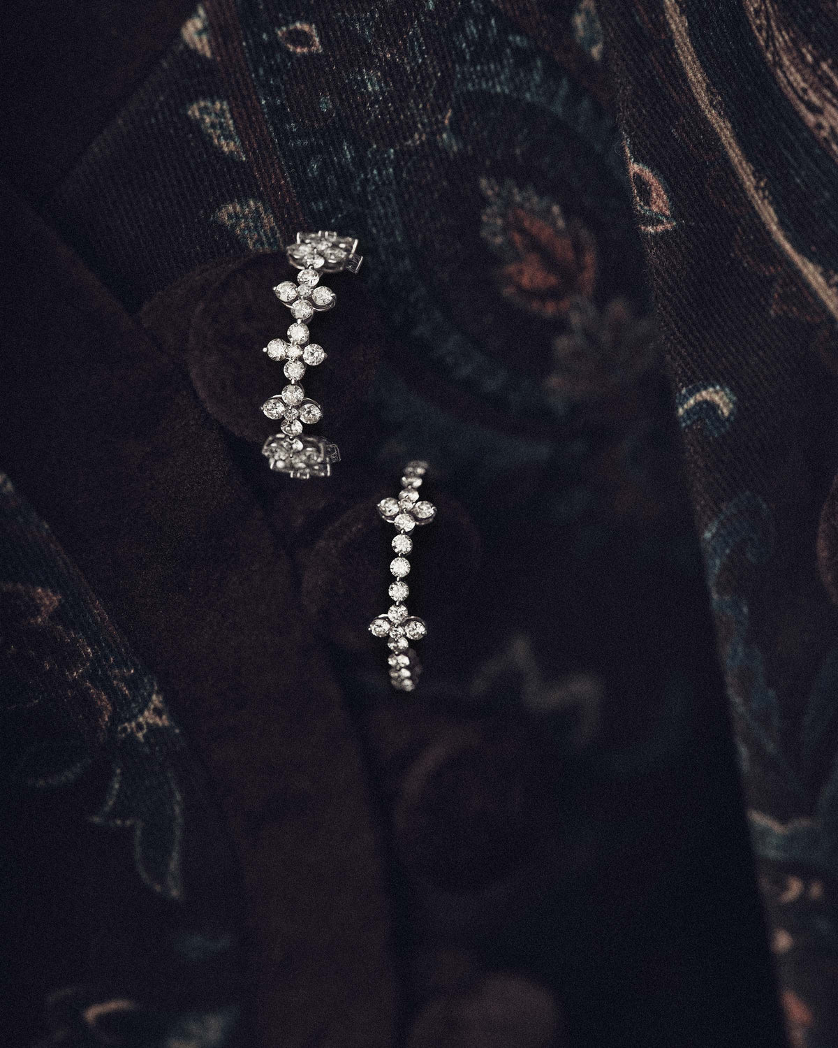 White gold necklace with lab-grown diamonds and floral accents.